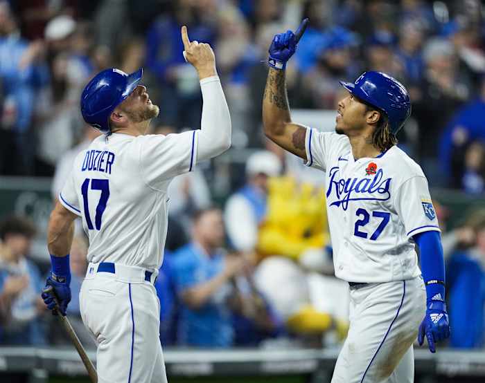 May 31, 2021; Kansas City, Missouri, USA; Kansas City Royals shortstop Adalberto Mondesi (27) celebrates with third baseman Hunter Dozier (17) after hitting a home run against the Pittsburgh Pirates during the fifth inning at Kauffman Stadium. Mandatory Credit: Jay Biggerstaff-USA TODAY Sports